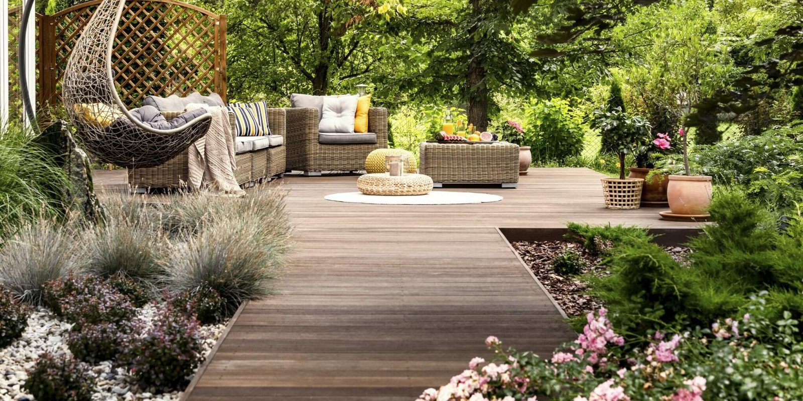 a deck with furniture and plants