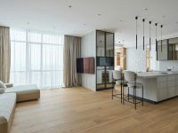 a room with a kitchen and dining area