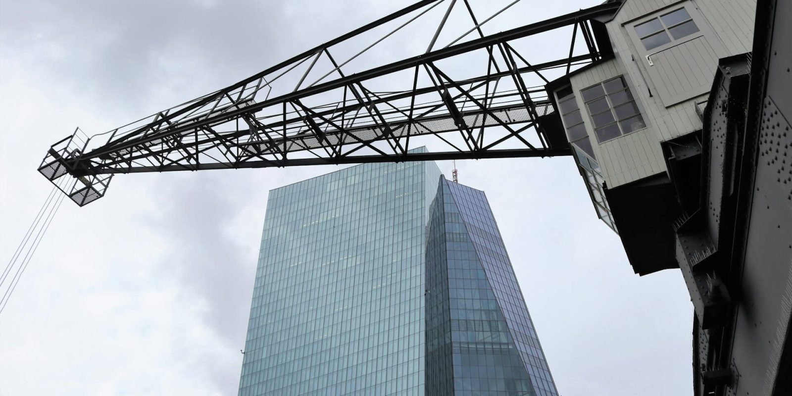 a crane and a tall building